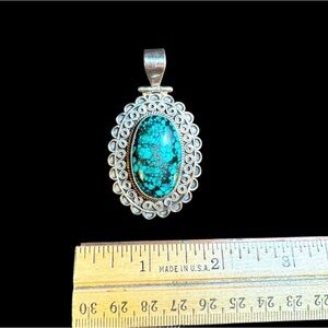 Sterling silver stone pendant. Beautiful piece. Black and turquoise color stone